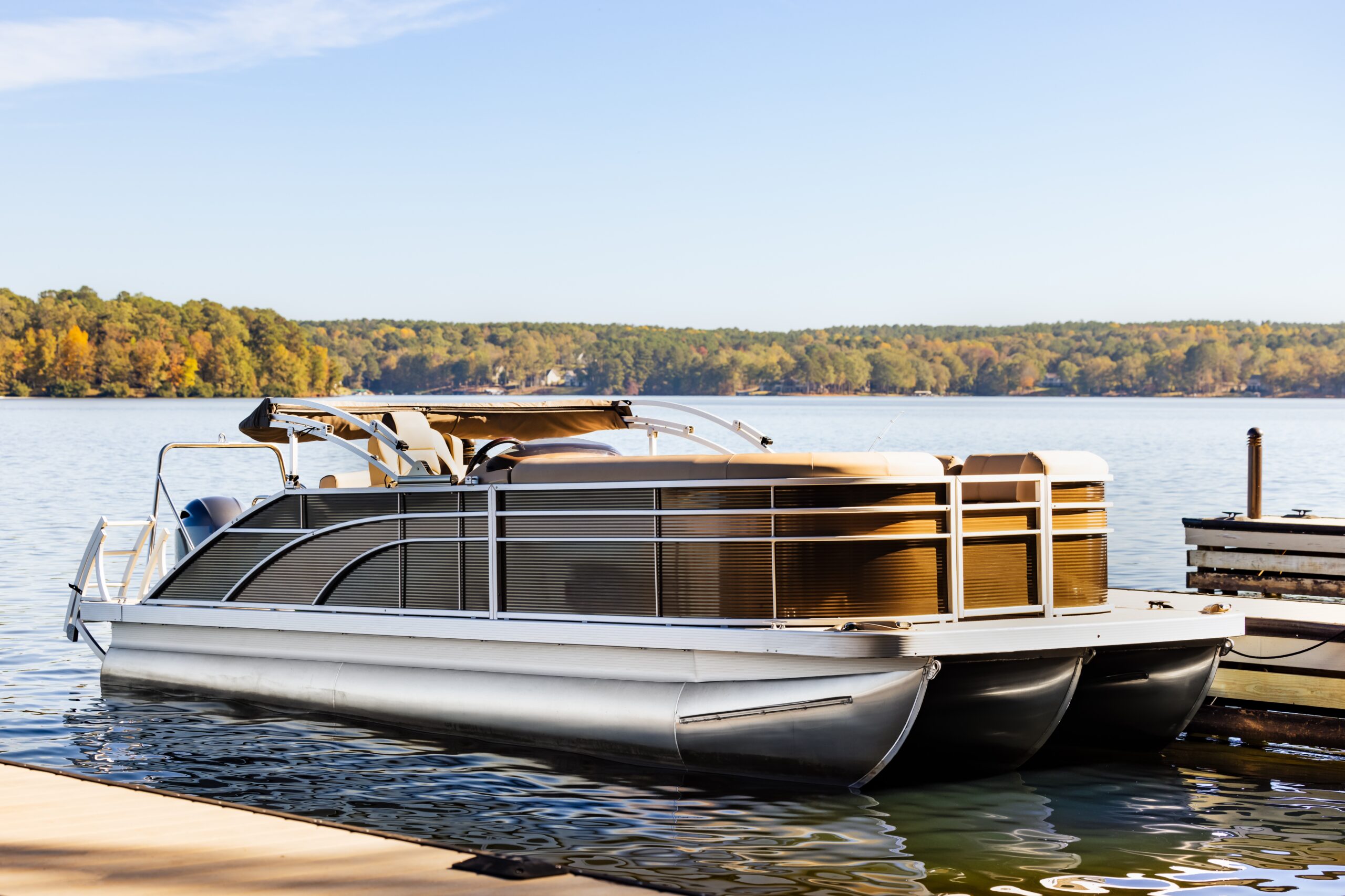 Pontoon boat at a dock 