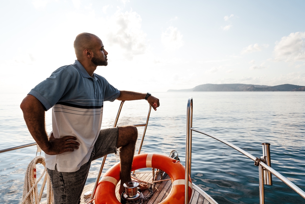 man standing on a boat