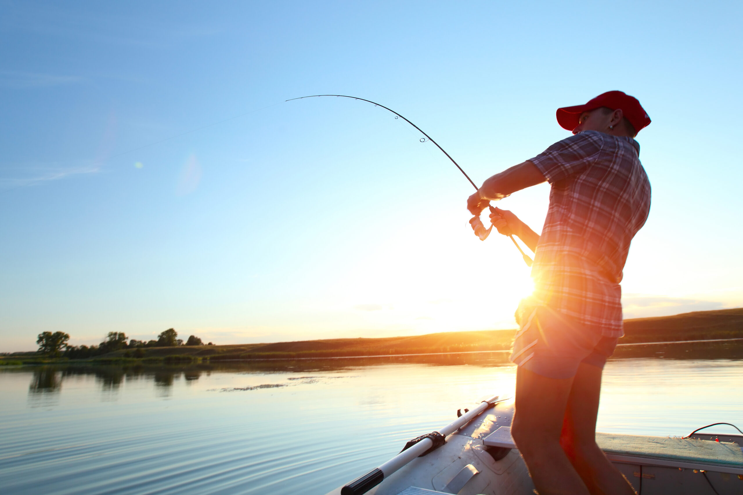 man fishing catching a big fish
