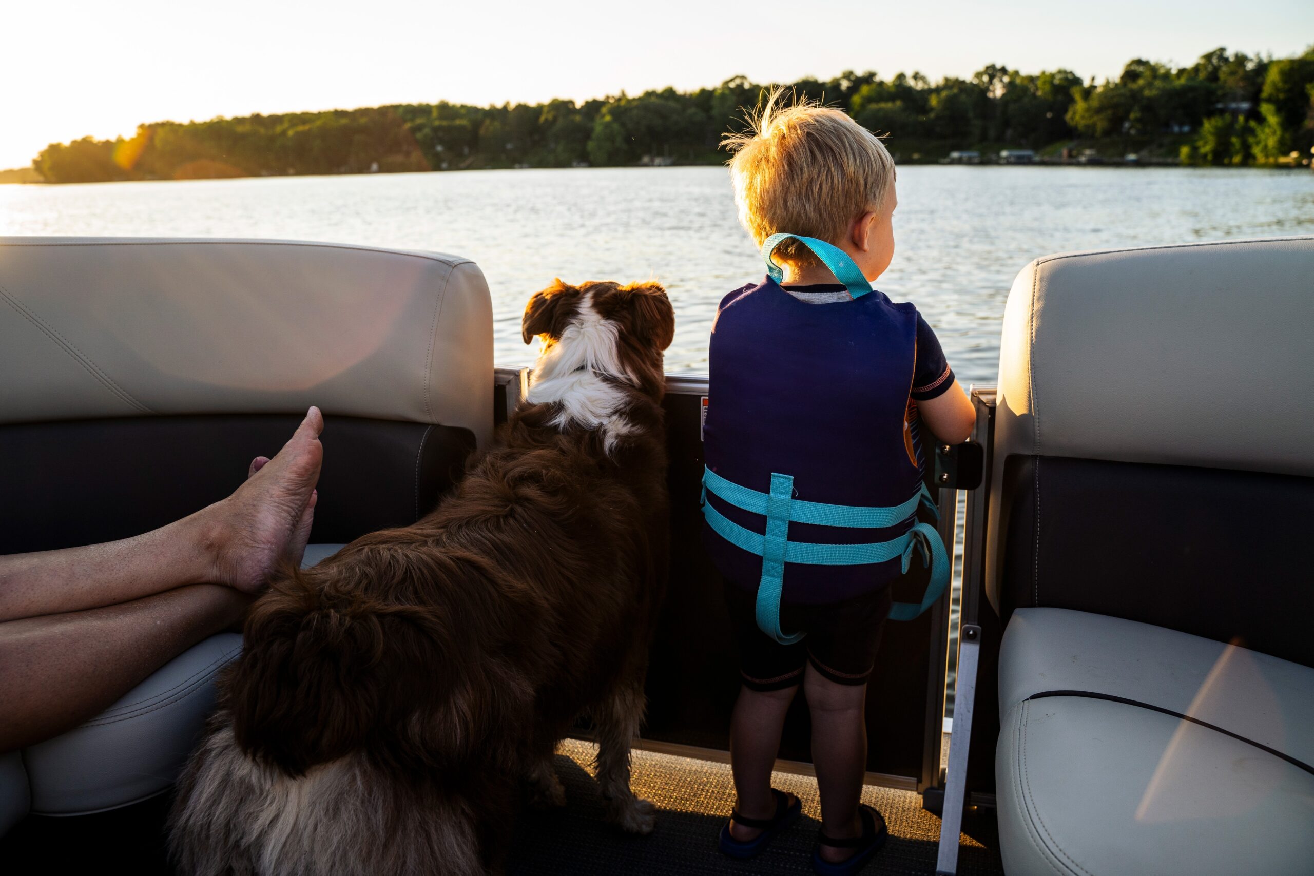 kid and dog on boat