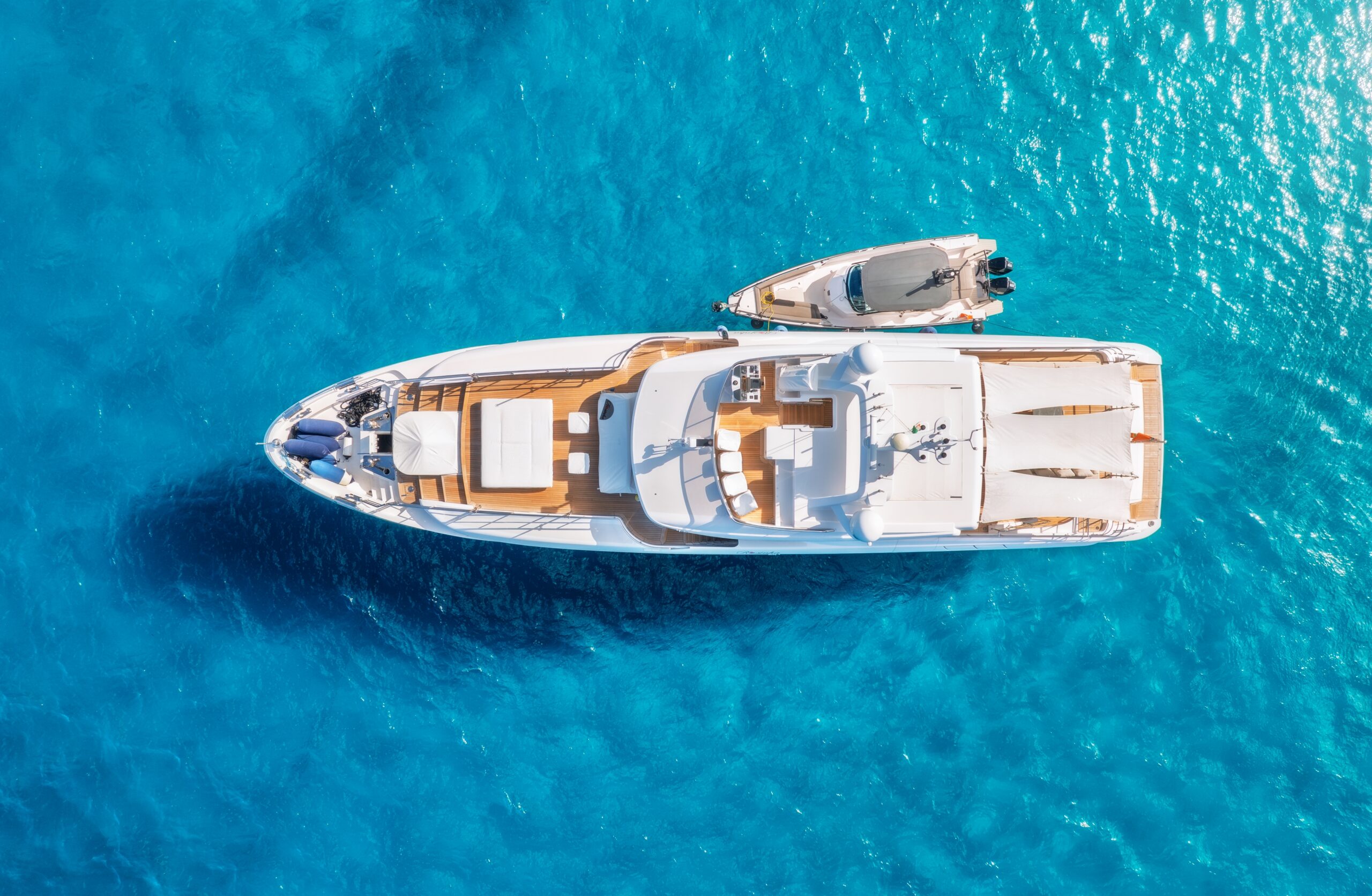 aerial view of yacht with a boat 