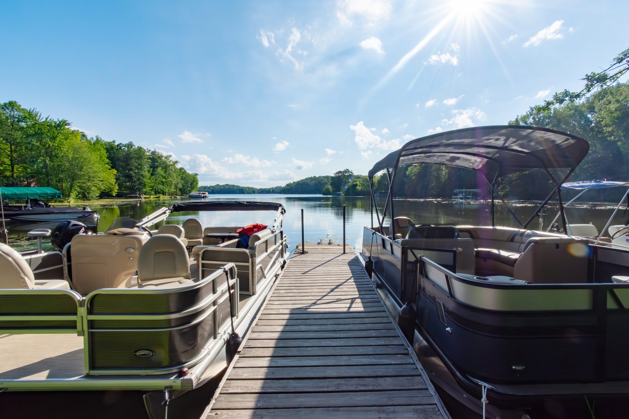 Pontoon boats docked at a lake