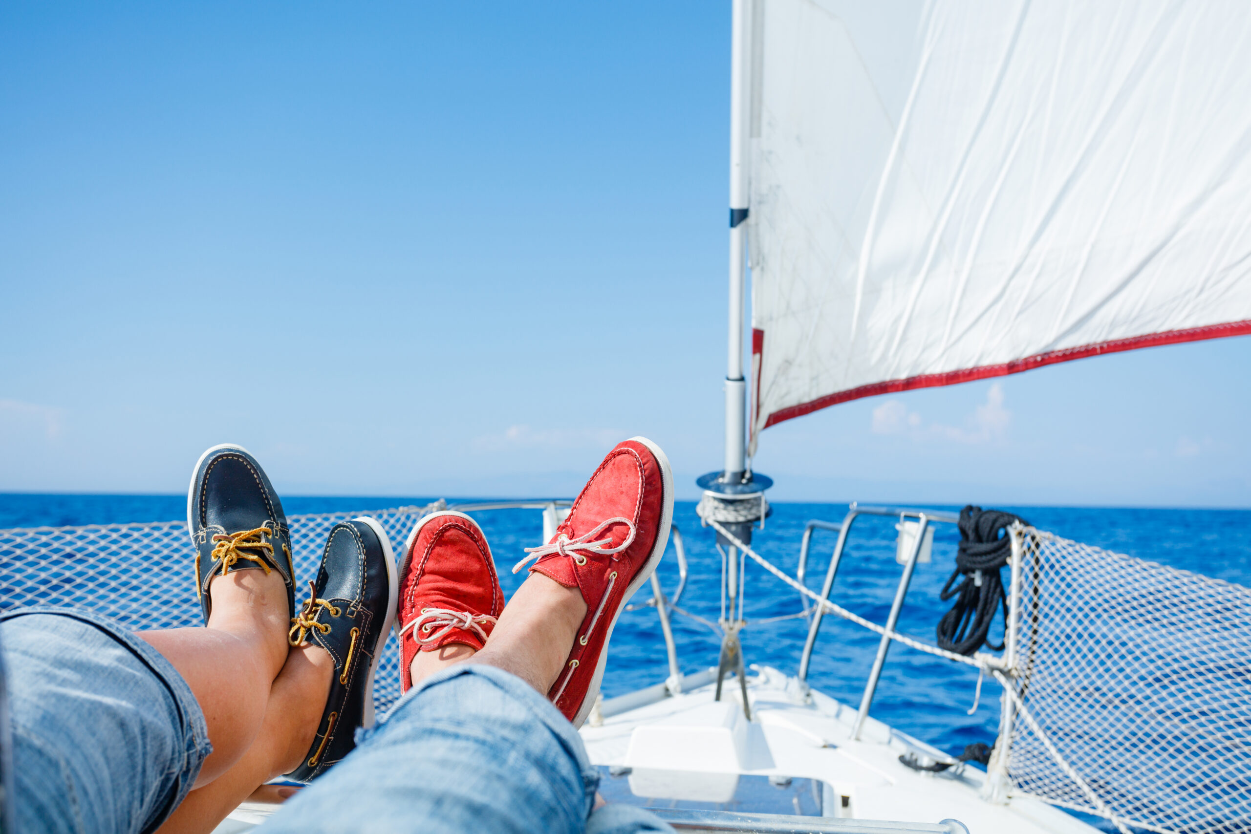 blue and red boat shoes on a sailboat